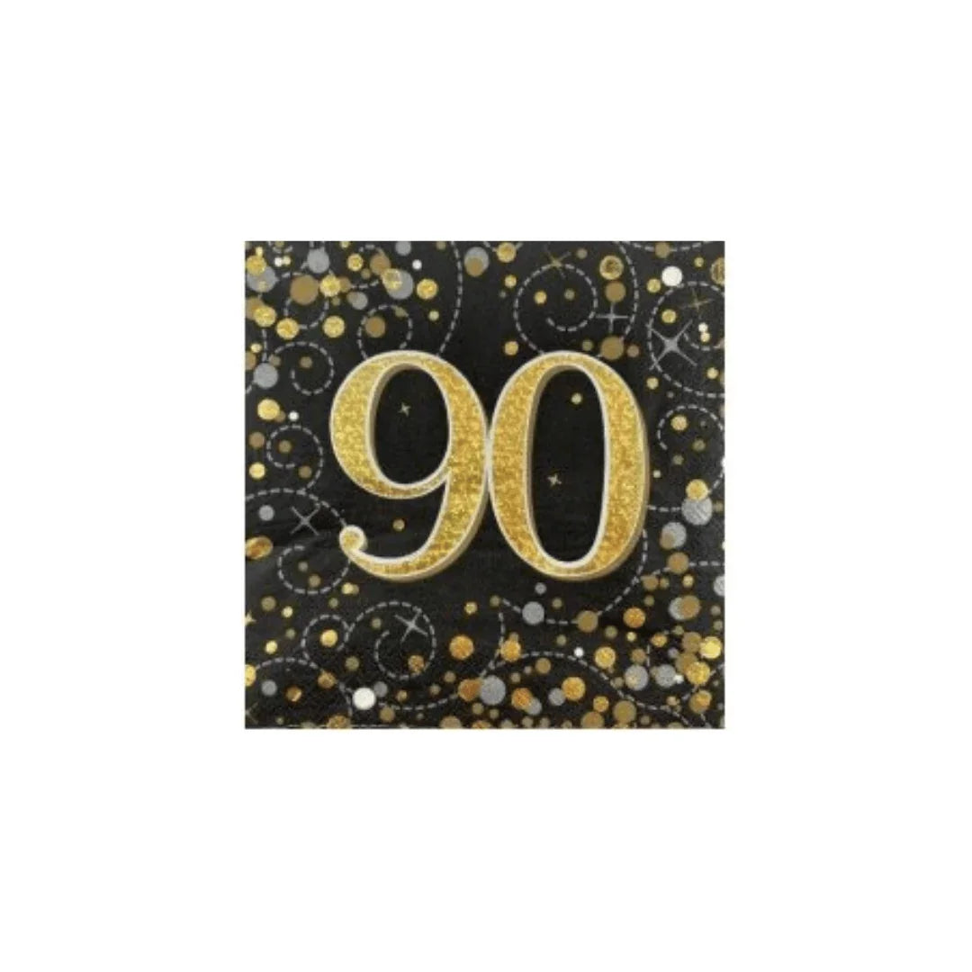 Black and gold glitter napkins featuring a large number 90 for a 90th birthday celebration