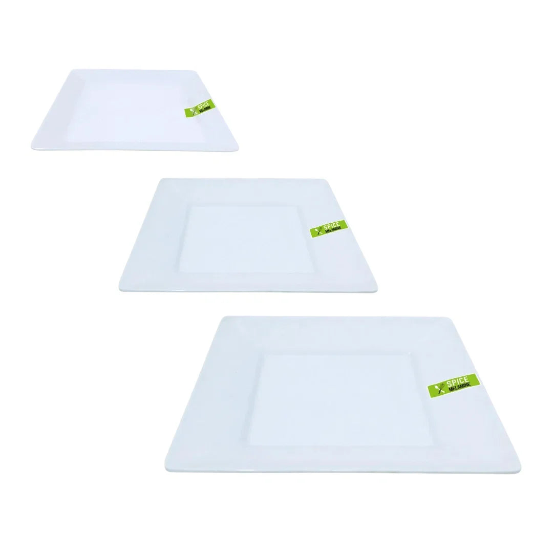 Three square white disposable catering plates of varying sizes