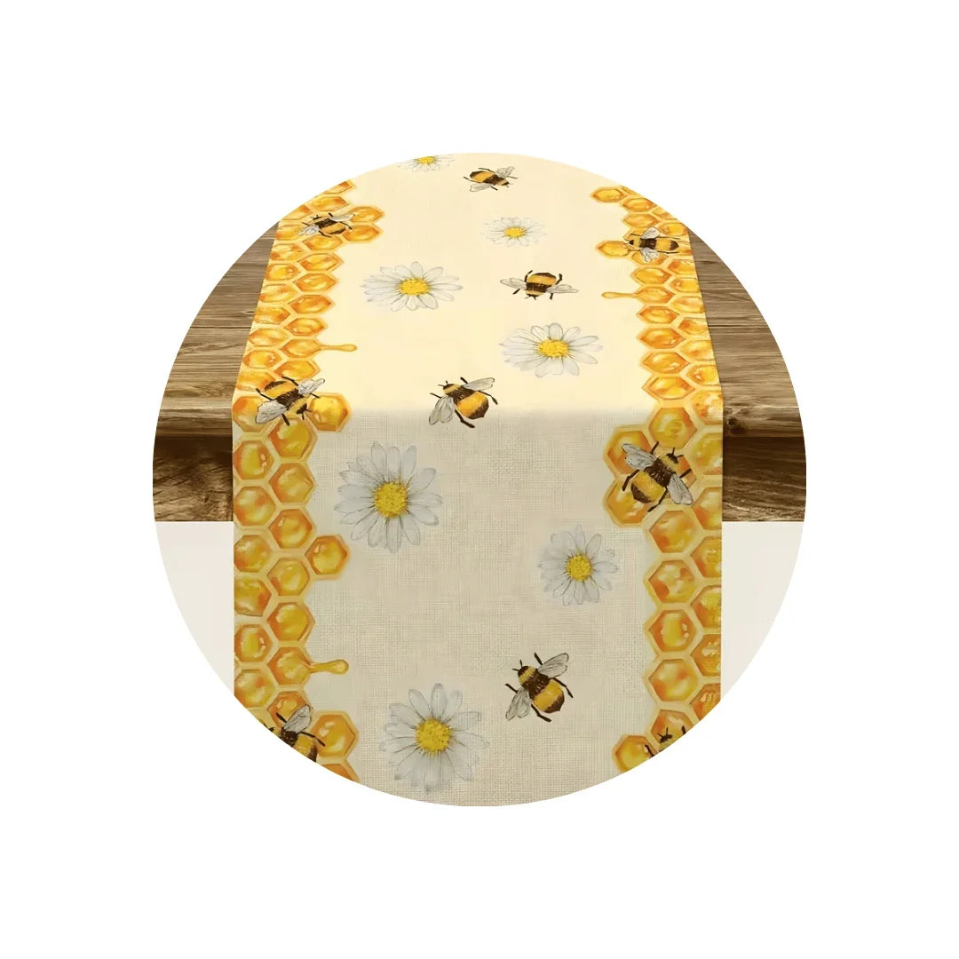Bee and daisy pattern table runner with honey comb borders on a round wooden table