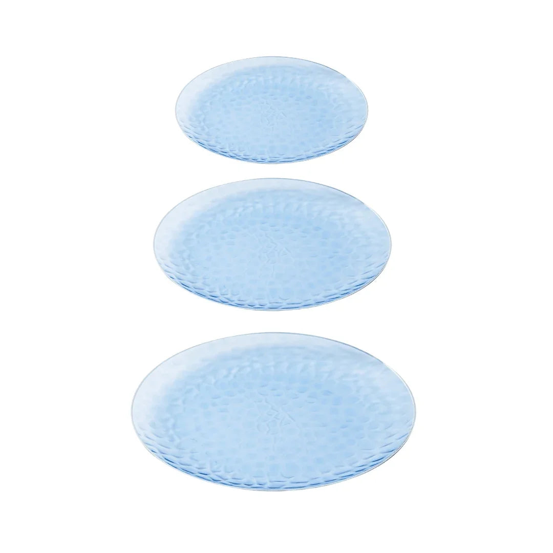Three light blue textured plastic plates of varying sizes arranged vertically
