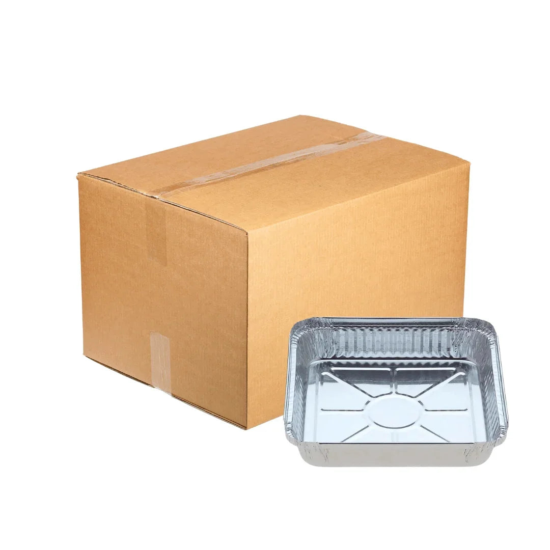 Disposable aluminum foil catering tray next to a brown cardboard shipping box