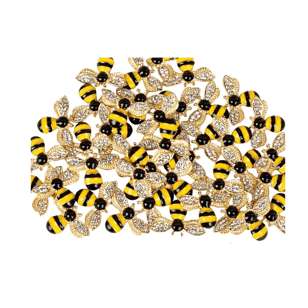 Collection of decorative golden bumblebee embellishments with yellow and black stripes