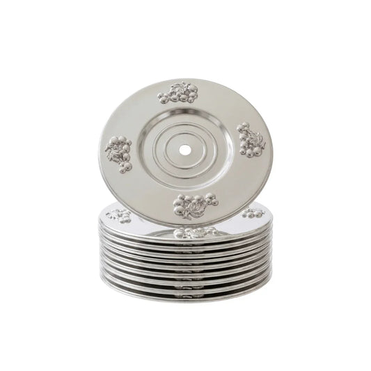 Stack of ornate silver decorative plates with grape motifs