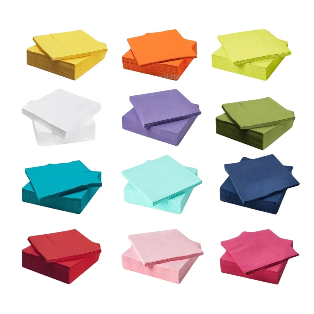 Assorted colorful stacks of disposable cocktail paper napkins in various vibrant shades
