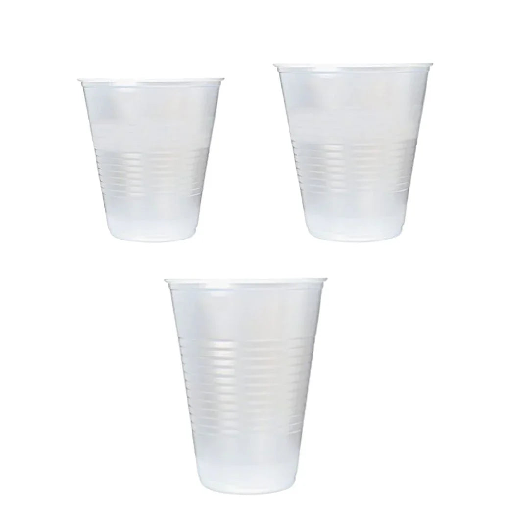 Three clear disposable plastic cups on a white background