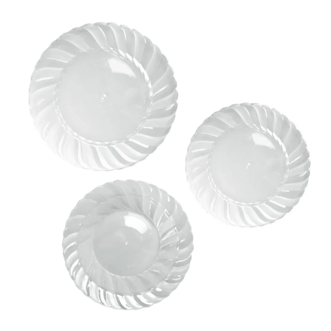 Three clear plastic disposable plates with a decorative swirled rim design