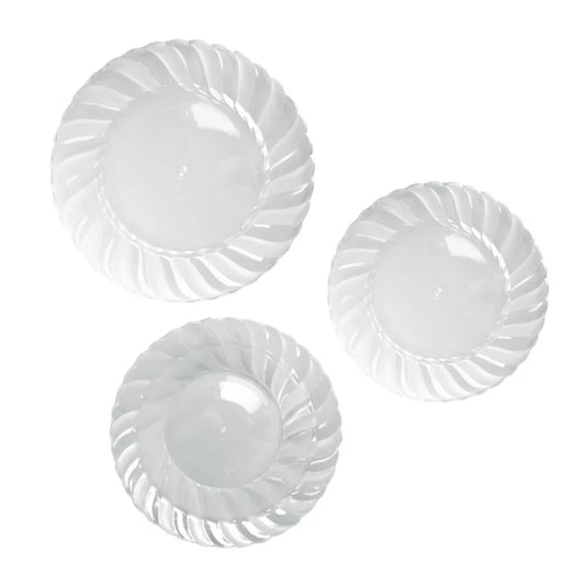 Three clear plastic disposable plates with a decorative swirled rim design