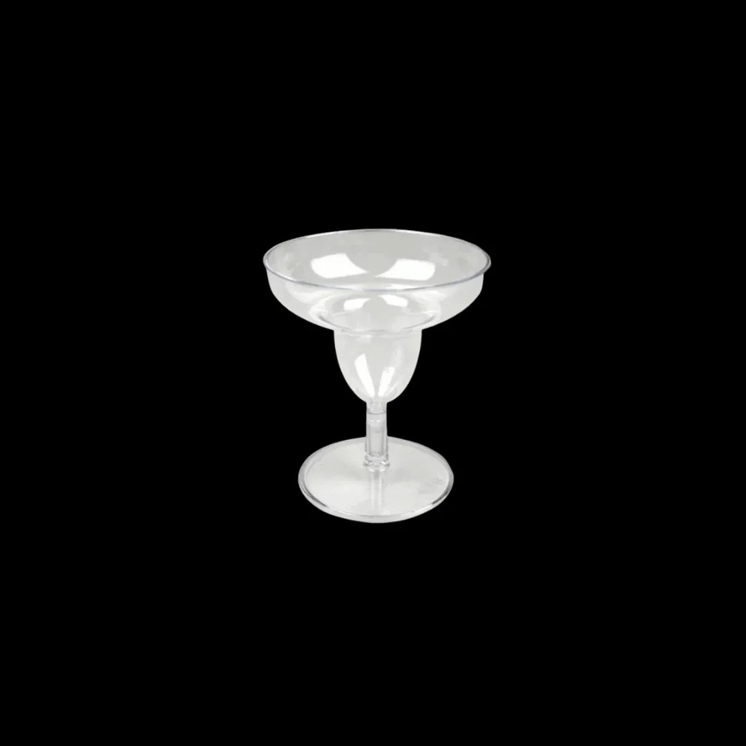 Clear plastic margarita glass on a black background