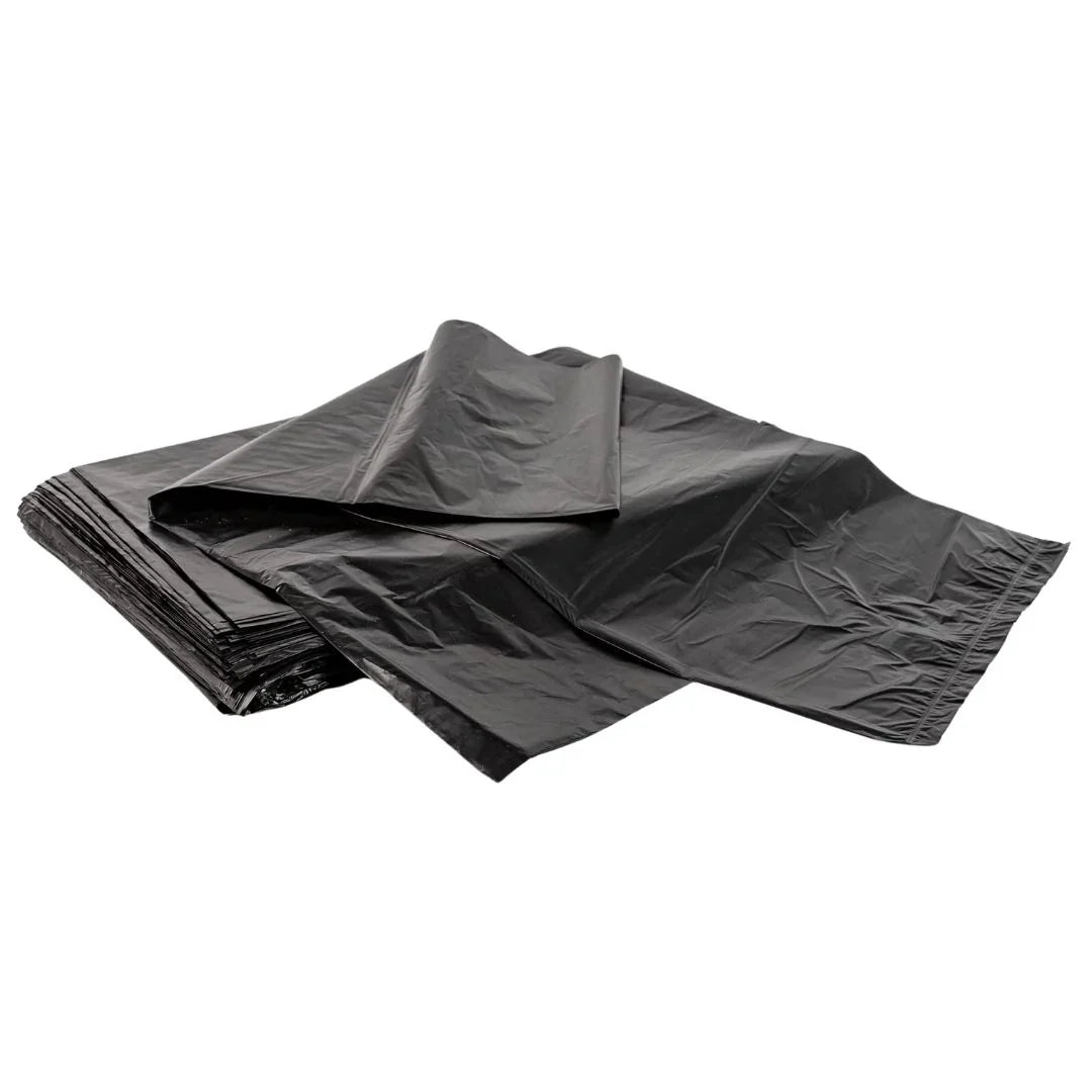 Stack of heavy-duty black plastic garbage bags on a white background