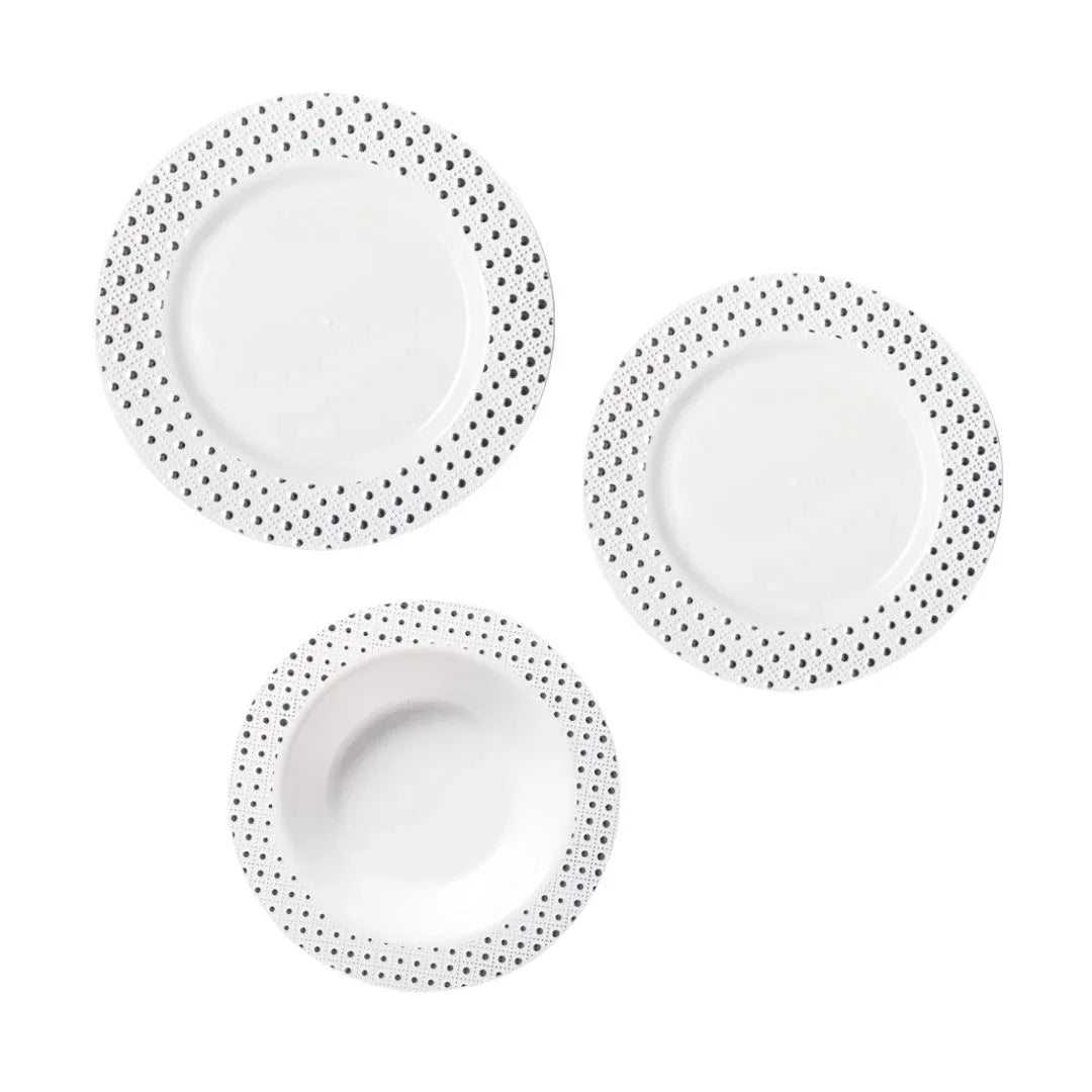 Three white disposable plates with black polka dot borders on a white background