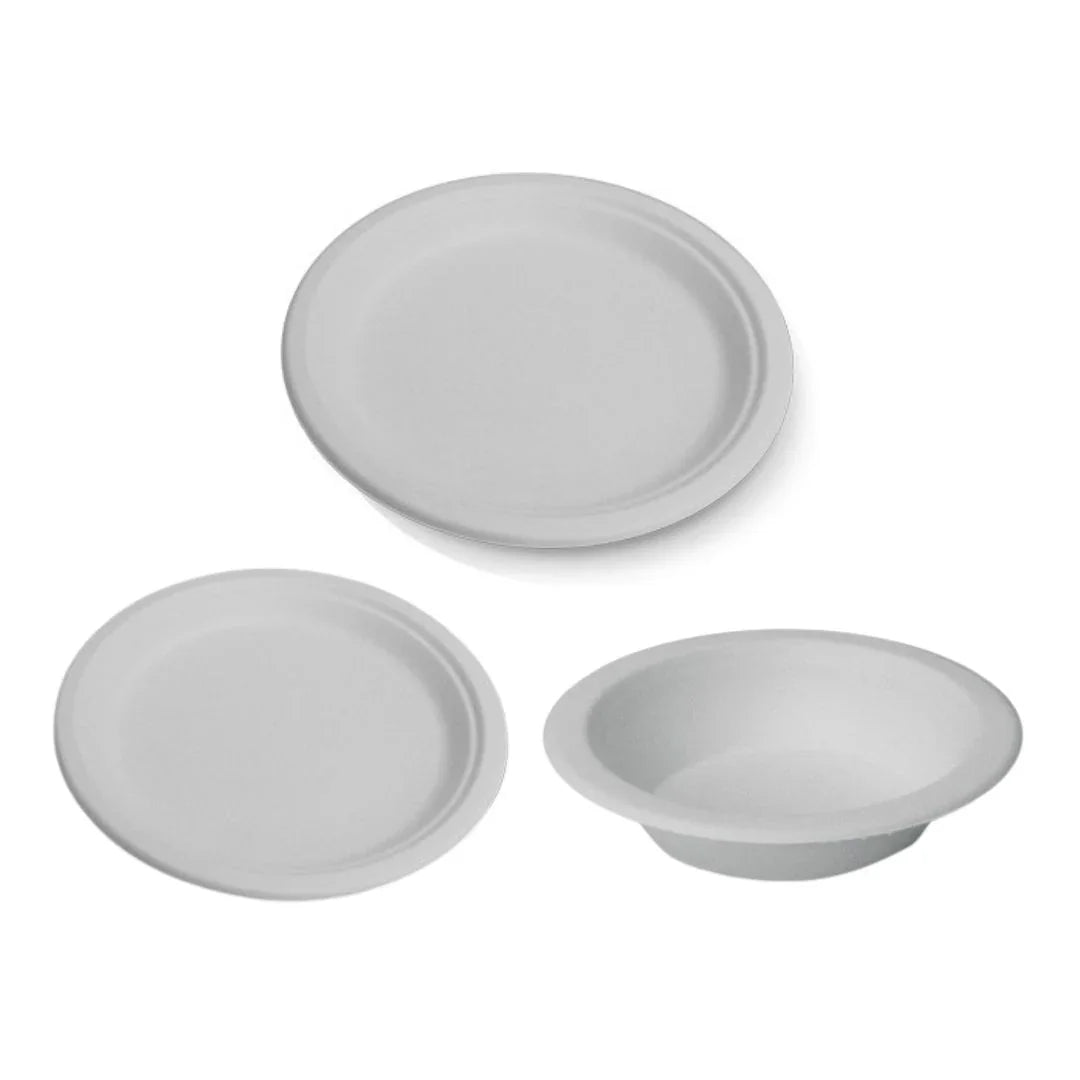 Set of three white disposable biodegradable paper plates and a bowl