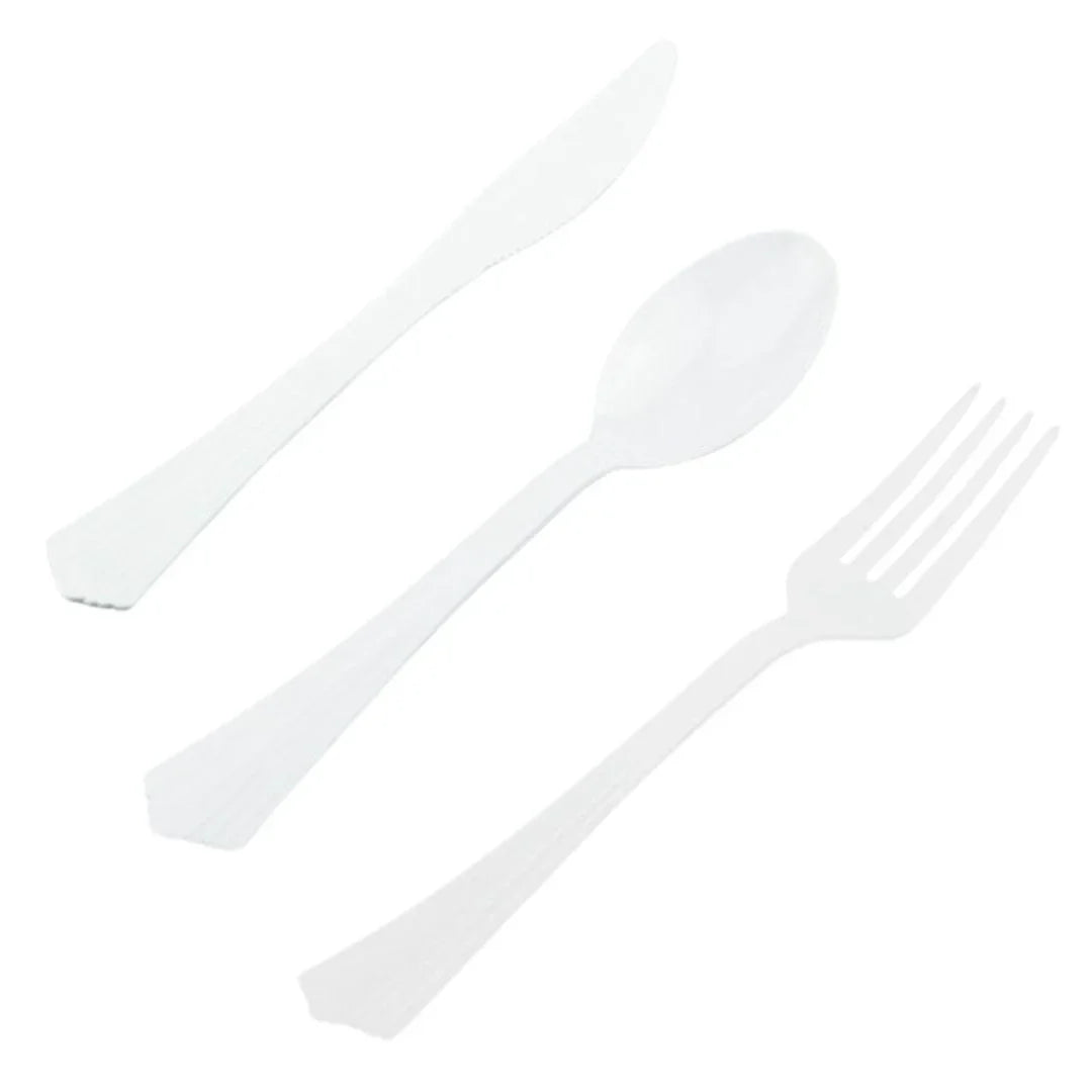 Set of white disposable plastic knife, spoon, and fork on a white background